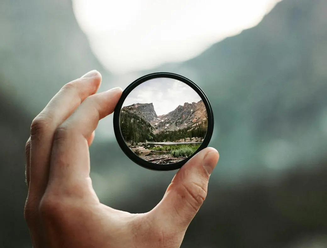 hand holding a focused lens